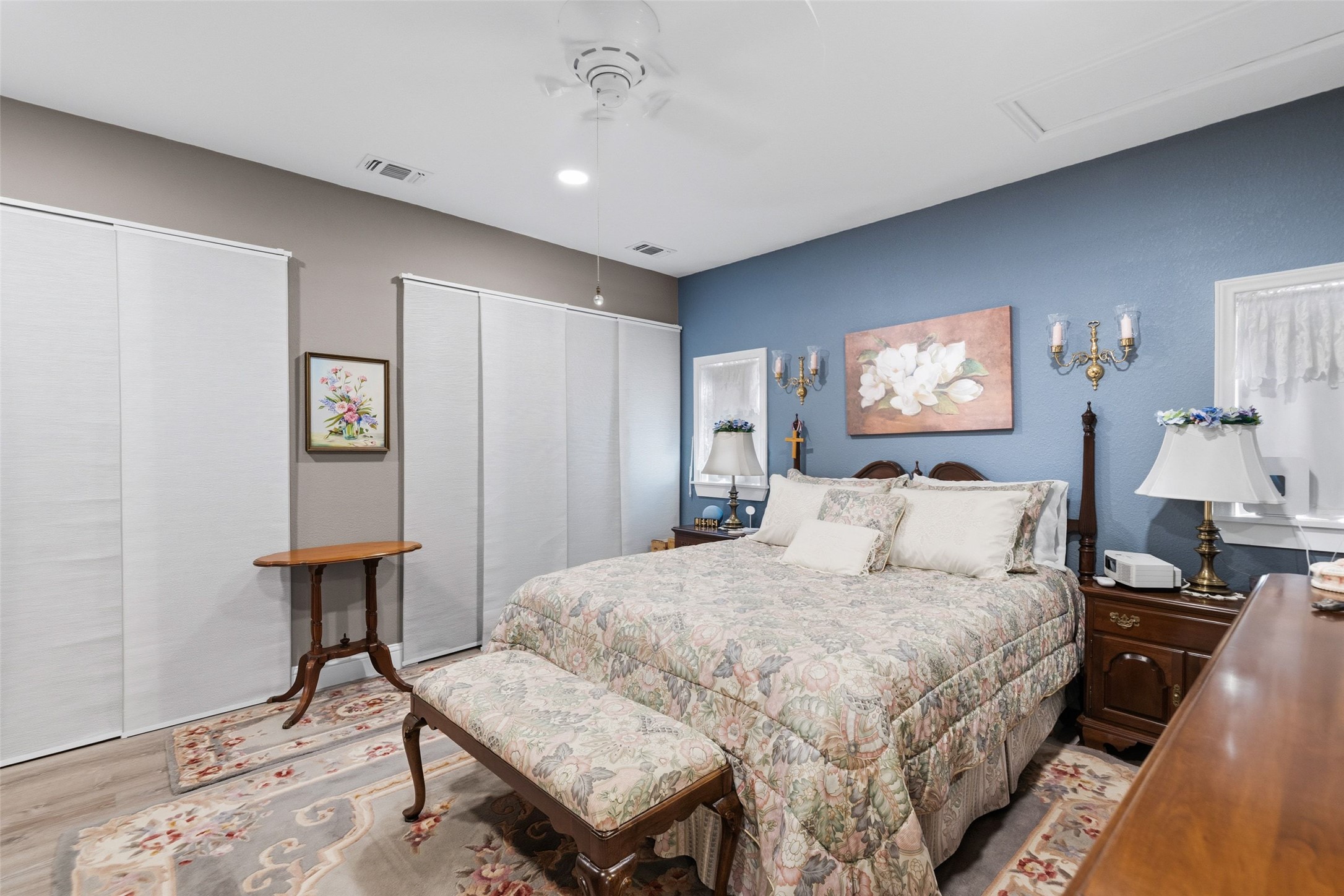 3764 Ranch Road 1623 Blanco, TX 78606 - Photo 21 of 36 A spacious bedroom offers warm wood-look flooring and ample closet space.