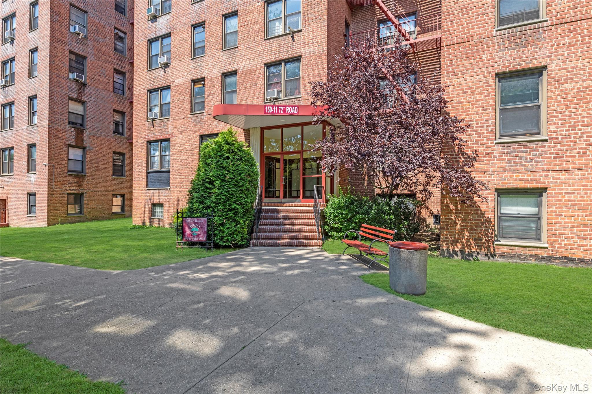 150-11 72nd Road, Unit 6E Queens, NY 11367 - Photo 11 of 13 a front view of a house with garden
