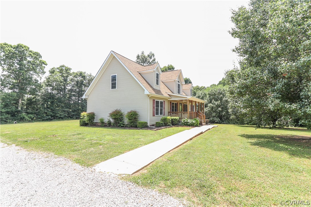 1831 Scuffletown Road Rice, VA 23966 - Photo 4 of 49 a front view of a house with a yard and garage