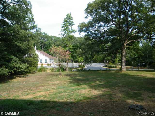 2710 Old Gun Road West Midlothian, VA 23113 - Photo 11 of 12 a backyard of a house with swimming pool and green space