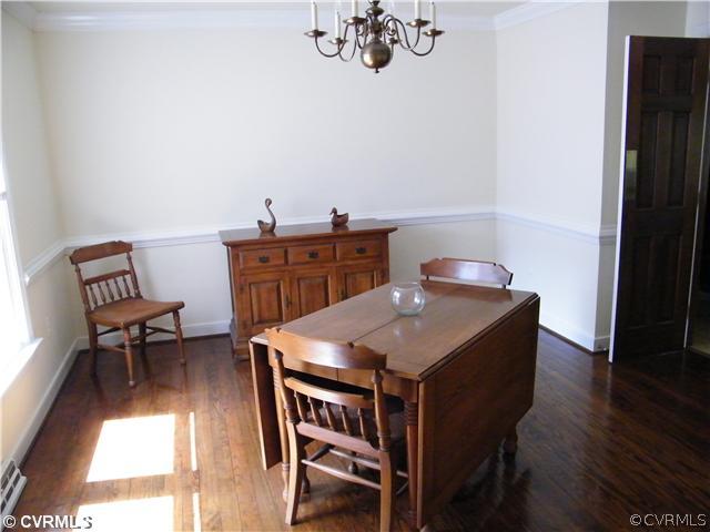 2710 Old Gun Road West Midlothian, VA 23113 - Photo 4 of 12 a view of a dining room with furniture and wooden floor
