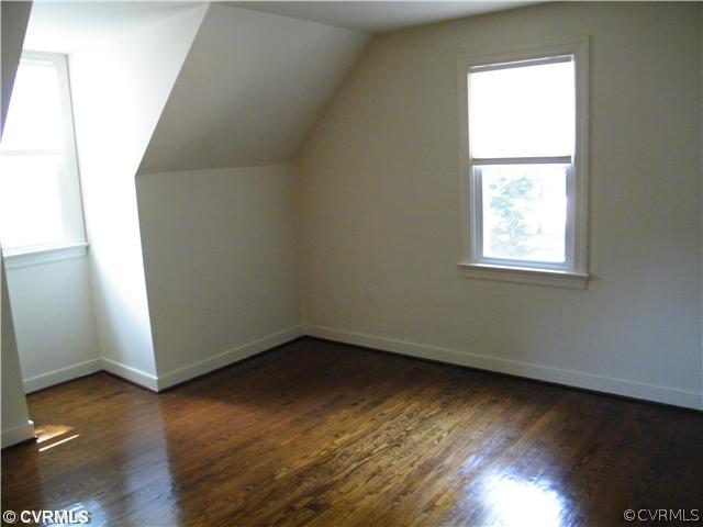 2710 Old Gun Road West Midlothian, VA 23113 - Photo 9 of 12 an empty room with wooden floor and windows