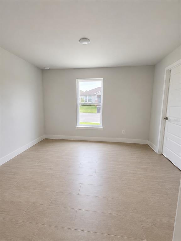 5892 Southwest 82nd Lane Ocala, FL 34476 - Photo 13 of 24 an empty room with a window