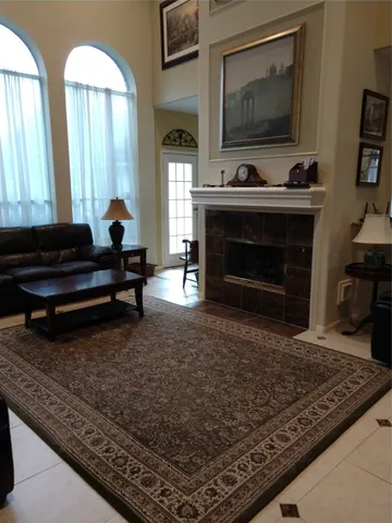 a living room with furniture and a fireplace