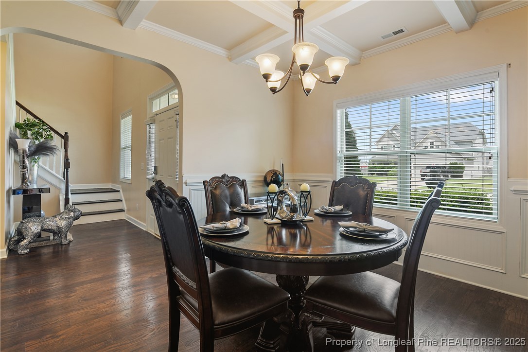 945 Pecan Grove Loop Hope Mills, NC 28348 - Photo 16 of 42 a view of a dining room with furniture window and wooden floor