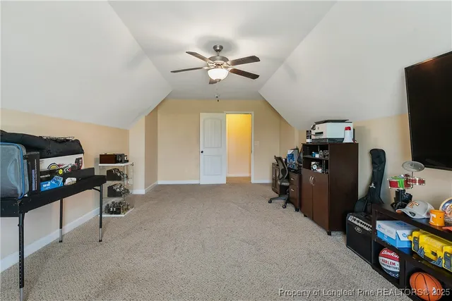 a living room with furniture a chandelier and a window