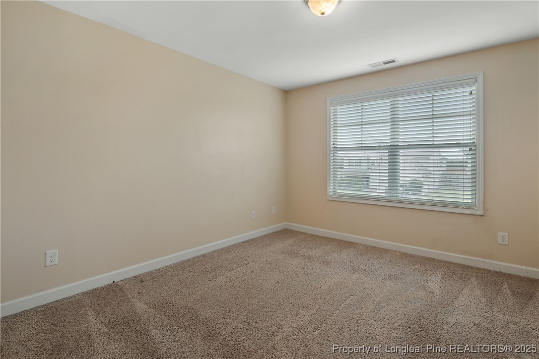 945 Pecan Grove Loop Hope Mills, NC 28348 - Photo 30 of 42 an empty room with windows