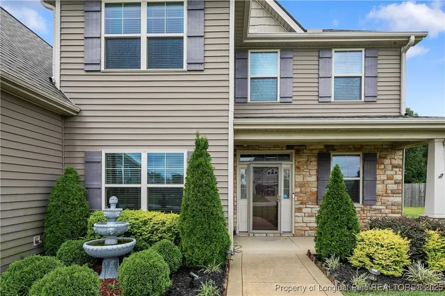 a front view of a house with a garage