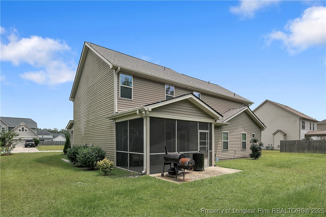 945 Pecan Grove Loop Hope Mills, NC 28348 - Photo 39 of 42 a front view of a house with garden