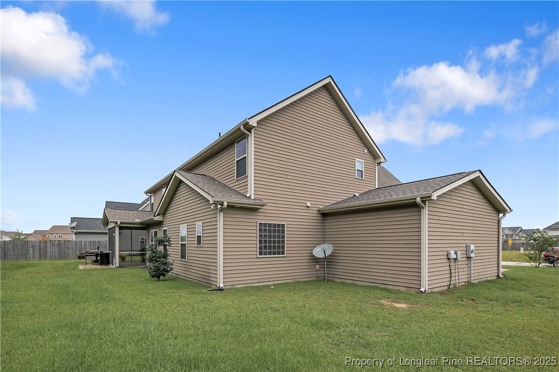 945 Pecan Grove Loop Hope Mills, NC 28348 - Photo 40 of 42 a view of a house with backyard