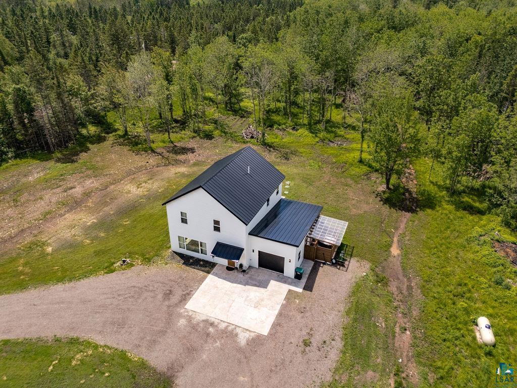 1825 East Shilhon Road Duluth, MN 55804 - Photo 2 of 35 Modern farmhouse exterior with white siding and a black metal roof.