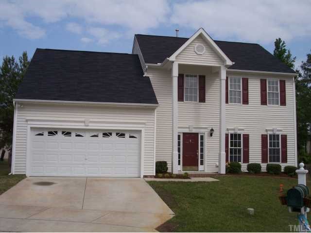 8405 Neuse Timbers Court Raleigh, NC 27616 - Photo 1 of 12 Front View of Home. Architectural Details include the Two Story Covered Porch, The Decorative Side Lights that Flank the Front Door and The Decorative Crown Moldings with Center Pediments Above the Front Door, Exterior Windows and the Garage.