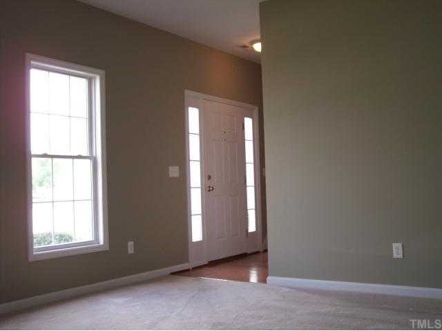 8405 Neuse Timbers Court Raleigh, NC 27616 - Photo 7 of 12 View of the Bright Formal Living Room Looking Toward the Entry Foyer. Energy Efficient Double Hung Windows Provide Ample Natural Light Throughout the Home Even on Overcast Days!