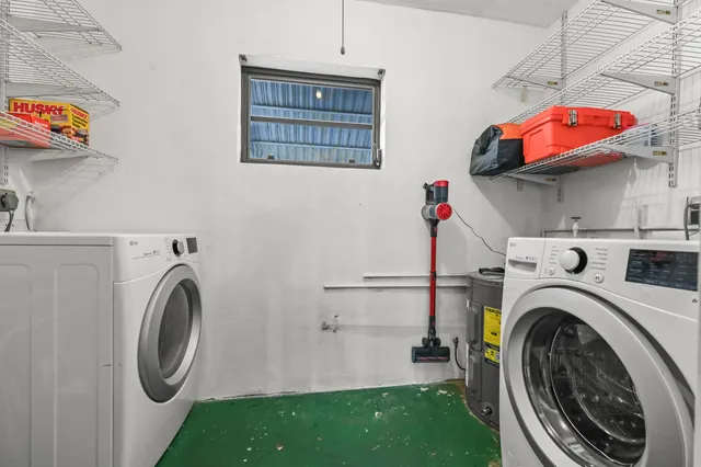 a utility room with dryer and washer