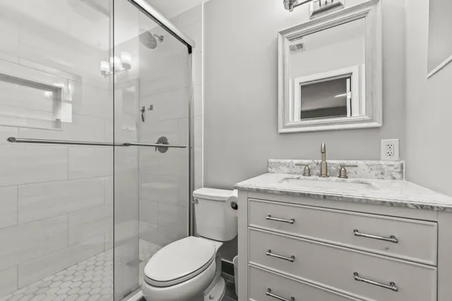 a patio with yard glass top table and chairs
