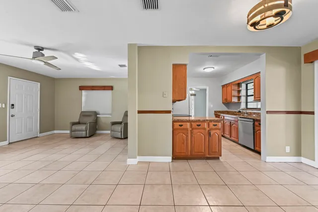 a kitchen with a sink and a stove top oven