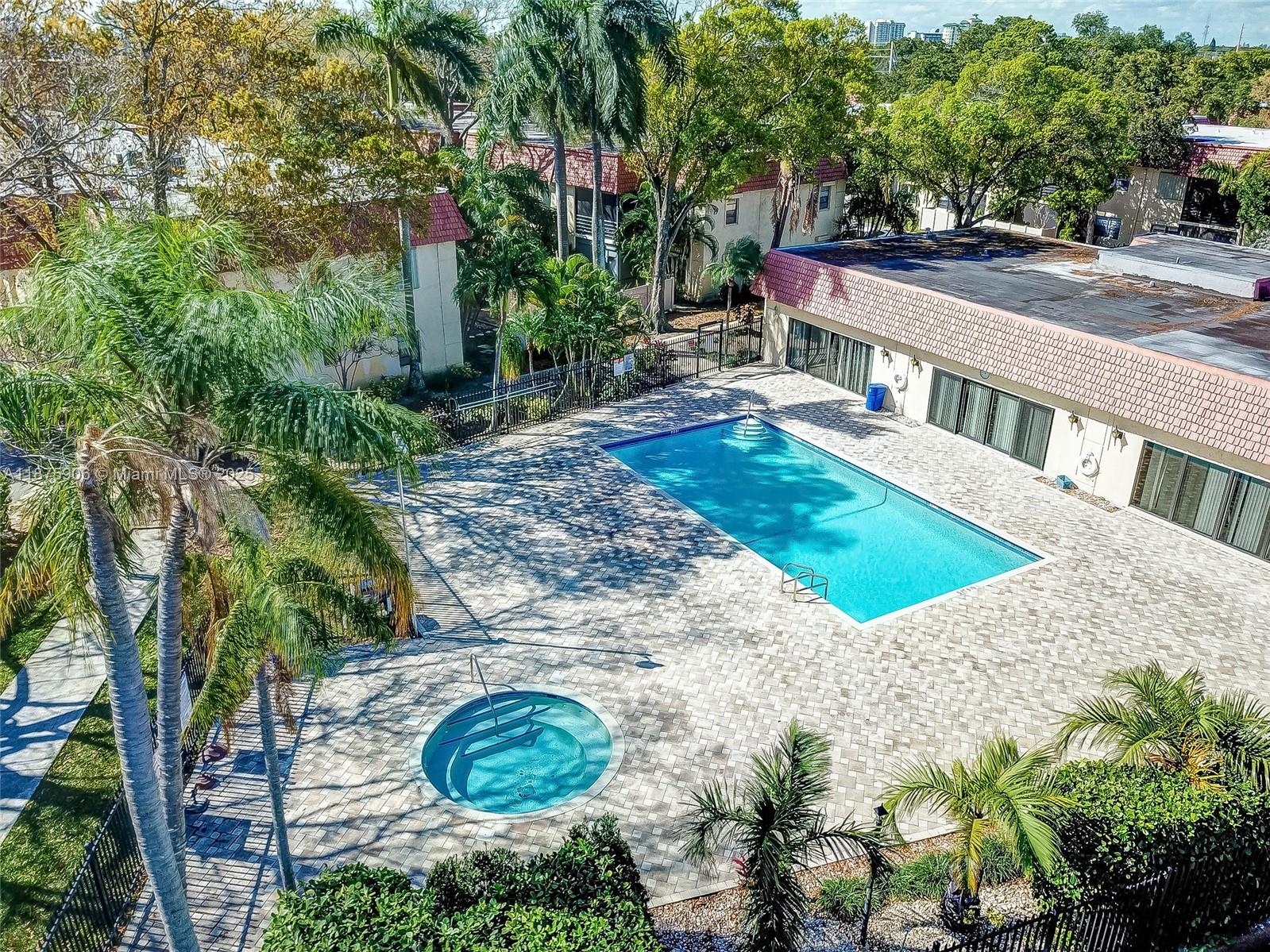 126 South Cypress Road, Unit 729 Pompano Beach, FL 33060 - Photo 20 of 21 a view of a house with a yard