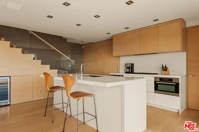 a kitchen that has a cabinets and a stove