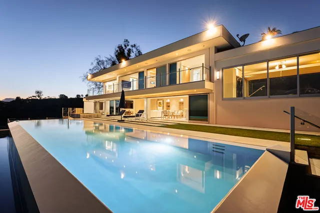 a view of a swimming pool with an outdoor seating