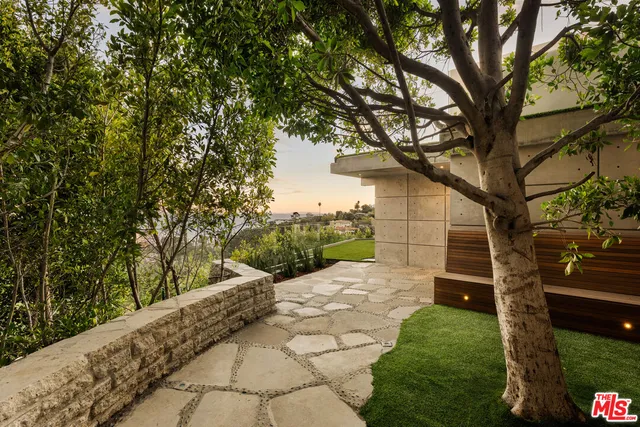 a backyard of a house with lots of green space