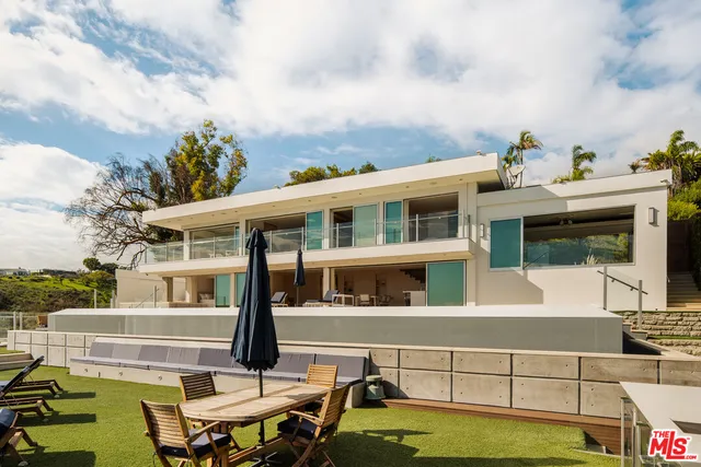 a view of pool with outdoor seating