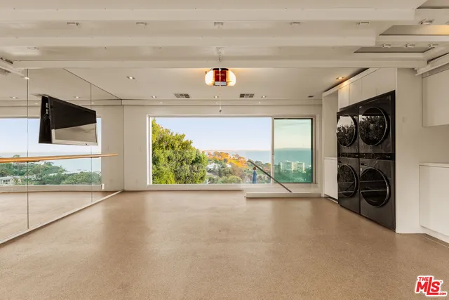a view of a living room and a floor to ceiling window