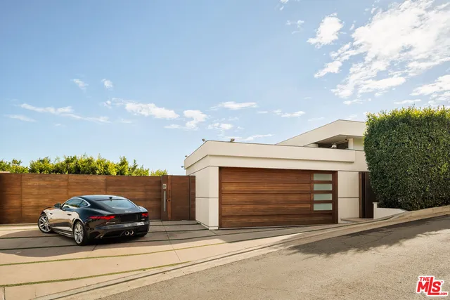 a car parked in front of a house