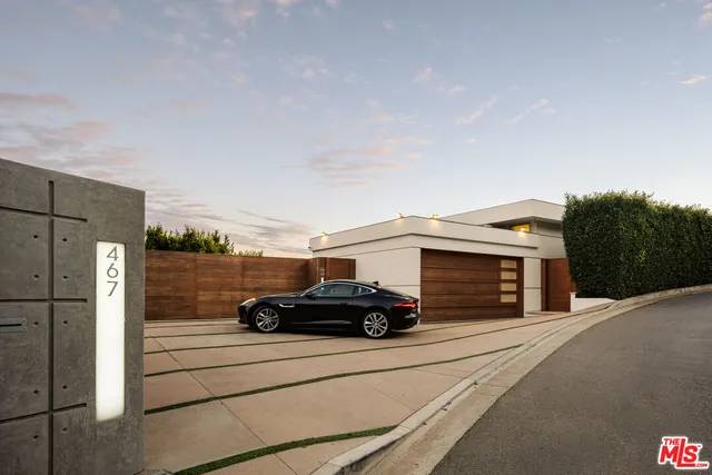 a car parked in front of a house