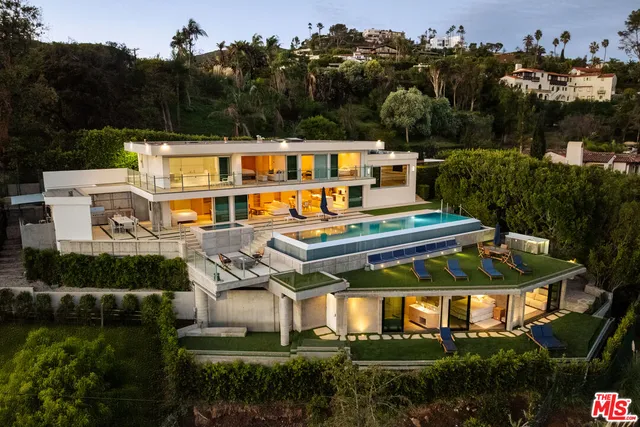 an aerial view of a house with a garden