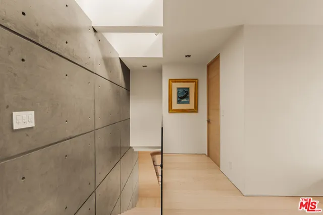 a view of a hallway with a white walls