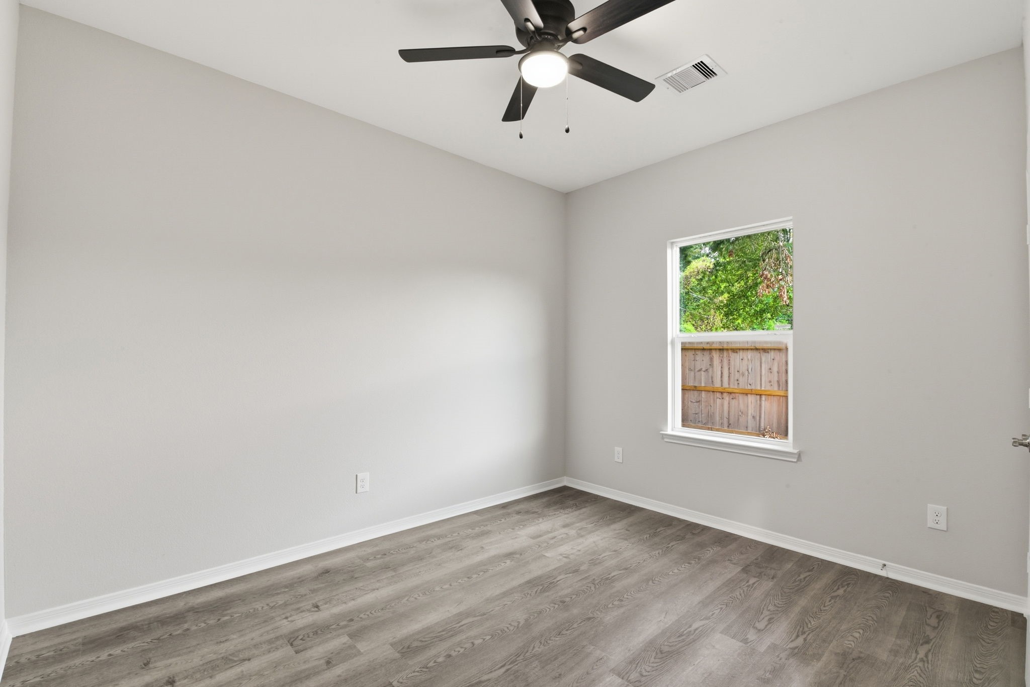 2521 Maple Street, Unit 2521A Liberty, TX 77575 - Photo 13 of 25 an empty room with a window