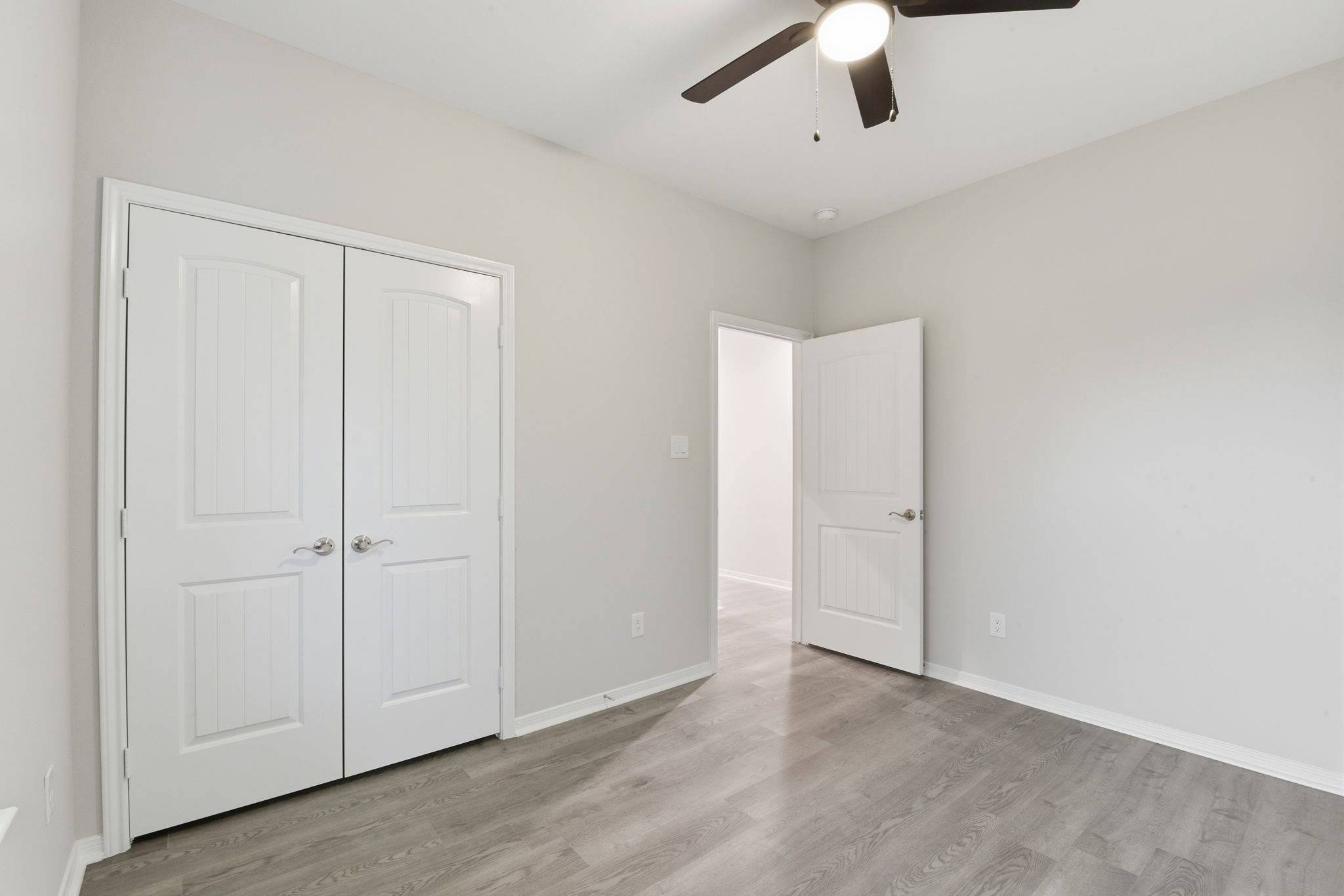 2521 Maple Street, Unit 2521A Liberty, TX 77575 - Photo 14 of 25 an empty room with a ceiling fan