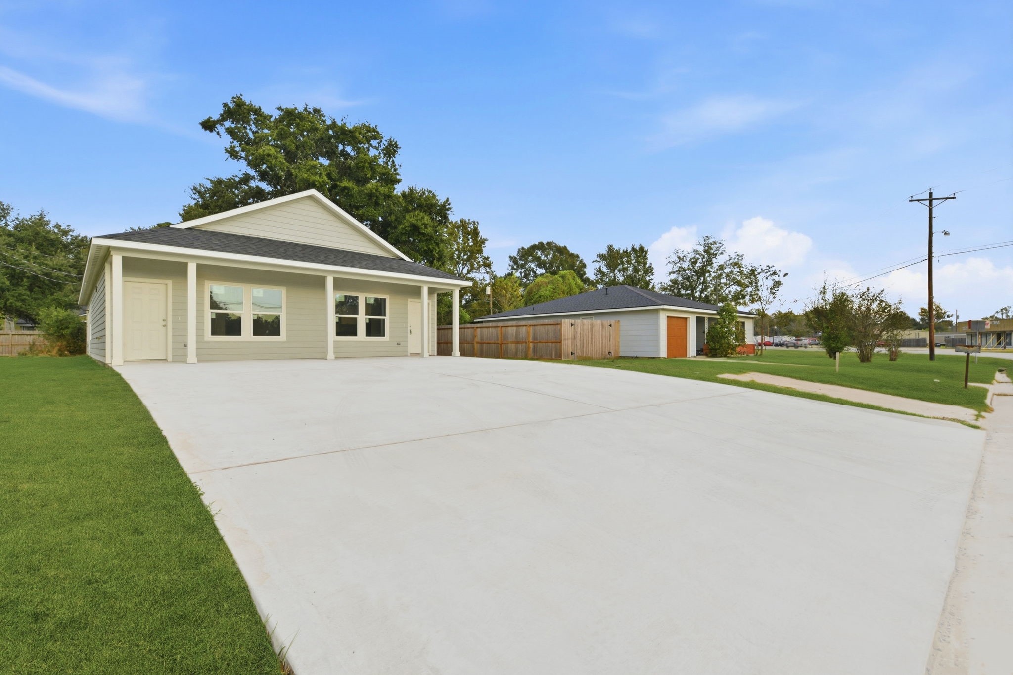 2521 Maple Street, Unit 2521A Liberty, TX 77575 - Photo 3 of 25 a front view of a house with a yard