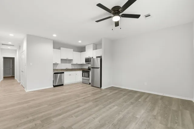 a view of kitchen with wooden floor
