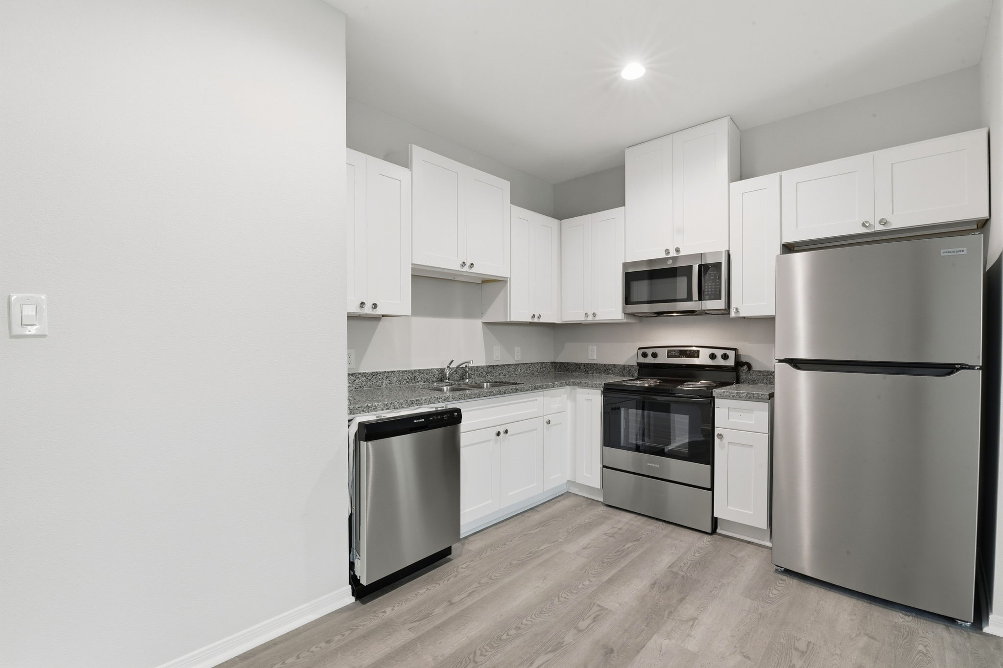 2521 Maple Street, Unit 2521A Liberty, TX 77575 - Photo 8 of 25 a kitchen with a refrigerator stove and microwave