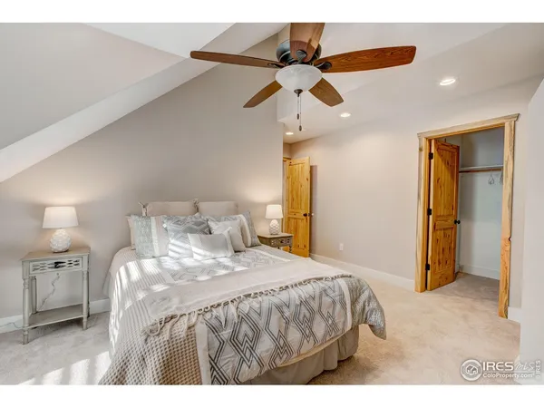 a bedroom with a bed and a walk in closet