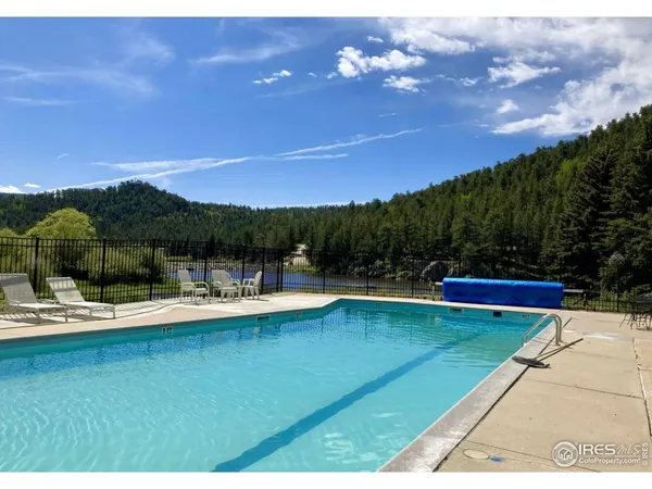 a view of a swimming pool with a patio