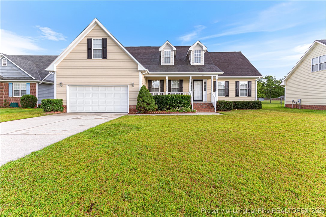 3831 Talus Road Fayetteville, NC 28306 - Photo 1 of 41 a front view of a house with a yard
