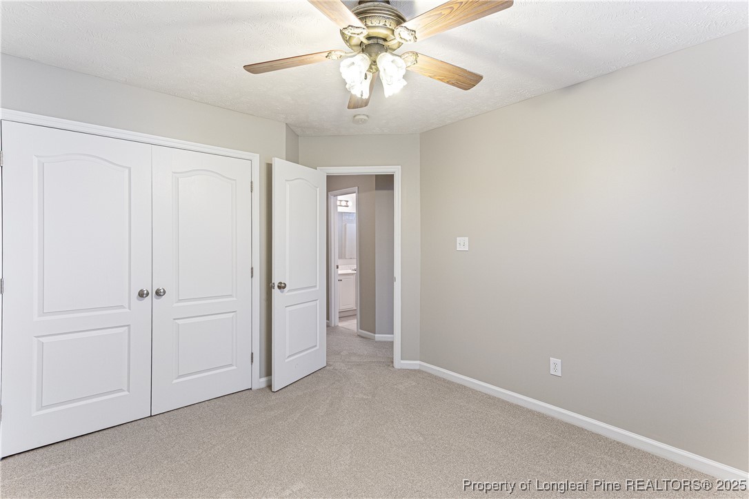3831 Talus Road Fayetteville, NC 28306 - Photo 29 of 41 a view of a chandelier fan and closet in a room