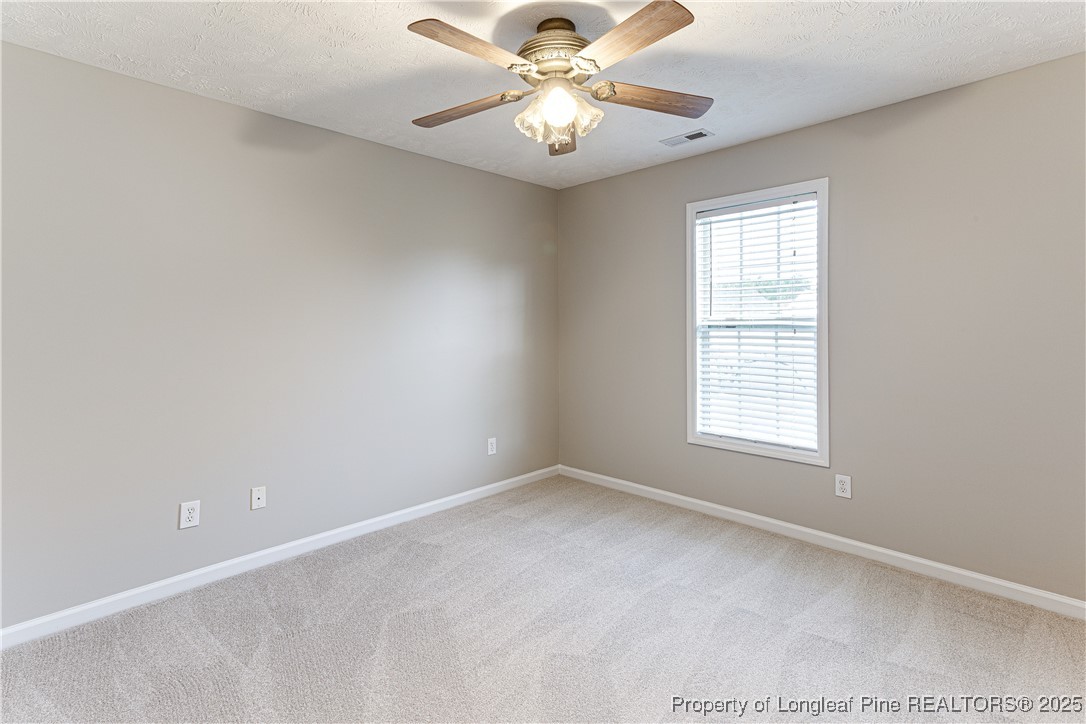 3831 Talus Road Fayetteville, NC 28306 - Photo 30 of 41 a view of an empty room with a window
