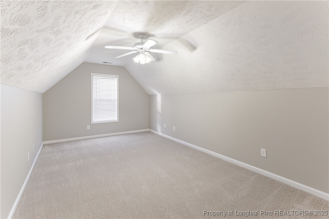 3831 Talus Road Fayetteville, NC 28306 - Photo 33 of 41 an empty room with windows and fan
