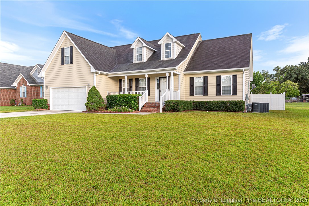 3831 Talus Road Fayetteville, NC 28306 - Photo 35 of 41 a front view of a house with a garden