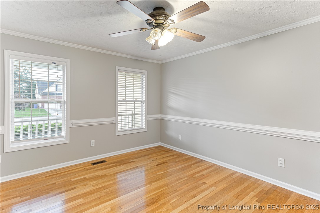 3831 Talus Road Fayetteville, NC 28306 - Photo 6 of 41 a view of empty room with wooden floor and fan