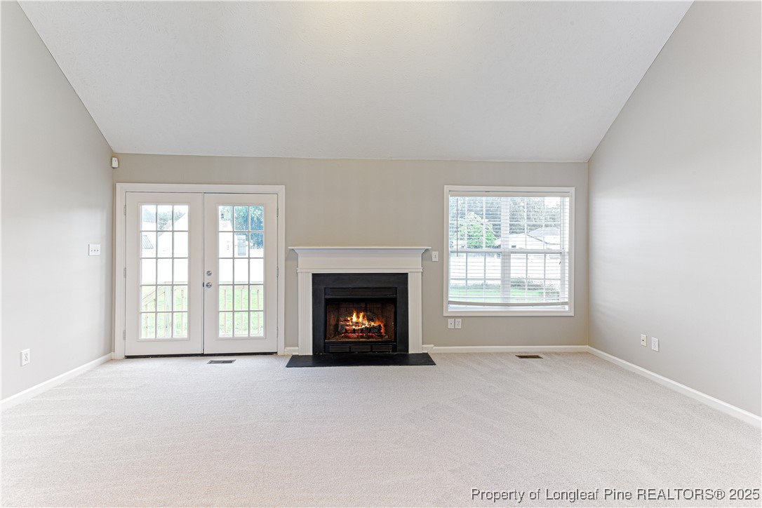 3831 Talus Road Fayetteville, NC 28306 - Photo 9 of 41 an empty room with a fireplace