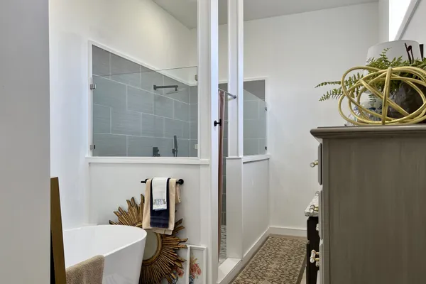 a bathroom with a sink a toilet and mirror