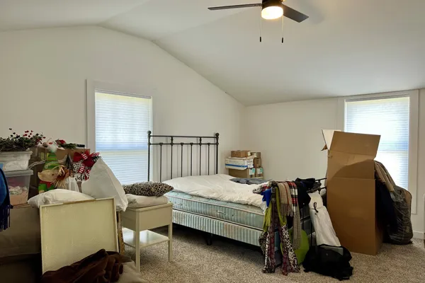 a bedroom with a bed and a closet