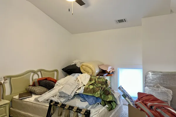 a view of a hallway with wooden shelves