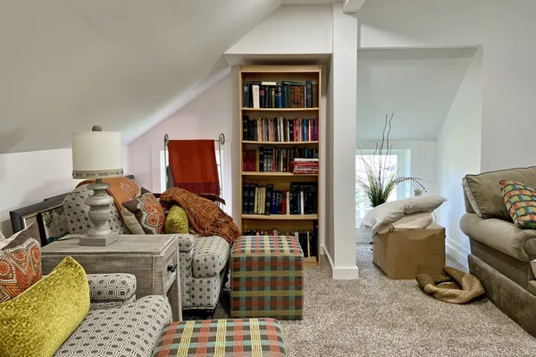 a dining room with furniture and a window