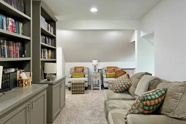 a white toilet sitting next to a shower curtain