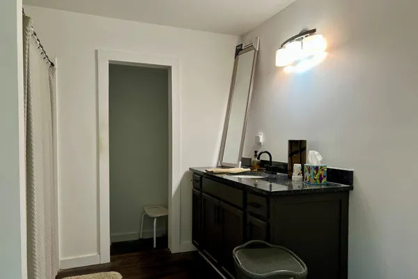 a bathroom with a shower and a curtain